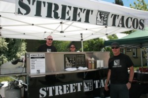 Calle 75 Street Tacos booth at the market