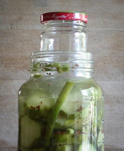 small jar inside large jar as a weight to submerse pickles